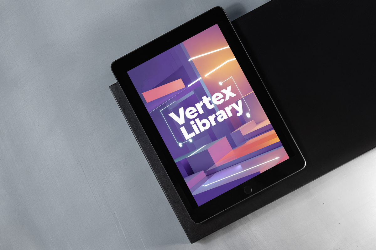 A black tablet device lying on a black stand against a brushed gray metal background, with the screen displaying the text 'Vertex Library' over a purple and orange abstract graphic.